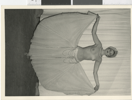 Photograph of a topless showgirl wearing a long, jeweled skirt, Dunes Hotel, Las Vegas (Nev.), 1957-1960s