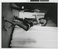 Photograph of male dancers with a showgirl onstage, Dunes Hotel, Las Vegas (Nev.), 1957-1960s