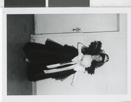 Photograph of a showgirl wearing a gown with a tiara, Dunes Hotel, Las Vegas (Nev.), 1957-1960s