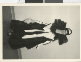 Photograph of a showgirl wearing a gown with a tiara, Dunes Hotel, Las Vegas (Nev.), 1957-1960s