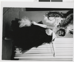Photograph of a showgirl wearing a gown with a tiara, Dunes Hotel, Las Vegas (Nev.), 1957-1960s