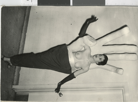 Photograph of a topless showgirl posing inside a giant prop hand, Dunes Hotel, Las Vegas (Nev.), 1957-1960s