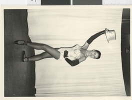 Photograph of a showgirl wearing a ballet costume with a top hat, Dunes Hotel, Las Vegas (Nev.), 1957-1960s