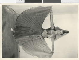 Photograph of a showgirl posing in a harem costume, Dunes Hotel, Las Vegas (Nev.), 1957-1960s