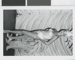 Photograph of a showgirl posing in a costume, Las Vegas (Nev.), 1957-1960s