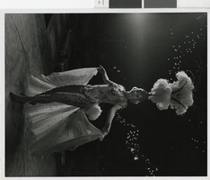 Photograph of a showgirl in fishnet dress, Las Vegas (Nev.), 1957-1960s