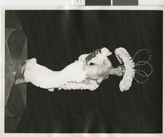 Photograph of showgirl in a topless ruffled costume, Las Vegas (Nev.), 1957-1960s