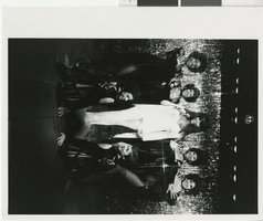 Photograph of seven Minsky's cast members posing on stage at the Aladdin, Las Vegas (Nev.), 1968-1973