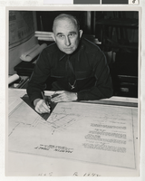Photograph of C. D. Baker working on plans, Las Vegas (Nev.), 1936-1946