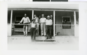 Photograph of men posing on porch, Pioche (Nev.), 1875-1893