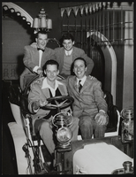 Photograph of Donn Arden and others posing in a car, Paris (FRA), 1940s