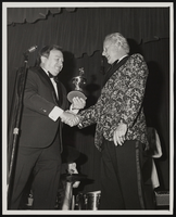 Black-and-white photograph of Donn Arden accepting an award, Las Vegas (Nev.), mid 1970s