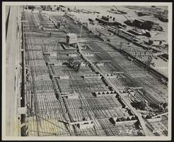 Photograph of workers reinforcing steel pipes, Henderson (Nev.), March 28, 1942