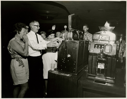 Photograph of people playing slots, Sands Hotel and Casino, Las Vegas, circa late 1950s-early 1960s