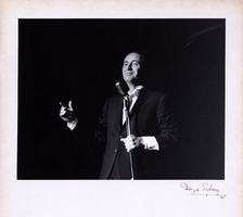 Photograph of Joey Bishop performing onstage in the Copa Room, the Sands Hotel, Las Vegas, 1960
