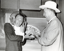 Photograph of Frank Sinatra in a space helmet with Jack Entratter, Las Vegas, circa 1957
