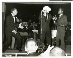 Photograph of Joey Bishop, Frank Sinatra and Sammy Davis, Jr. onstage at the Sands Hotel, Las Vegas, April 1966