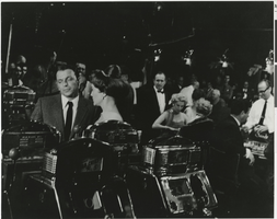 Photograph of Frank Sinatra with actress Patrice Wymore during filming of Ocean's Eleven in the casino of the Sands Hotel, Las Vegas, 1960