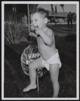 1957 New Year's Eve: photographs of a child with a lollipop