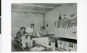 Photograph of "Lafayette" with unidentified patrons at the bar in Loves Cocktail Lounge