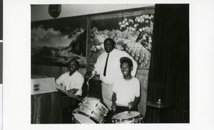 Photograph of Jimmy Love, owner of Loves Cocktail Lounge, with unidentified musicians