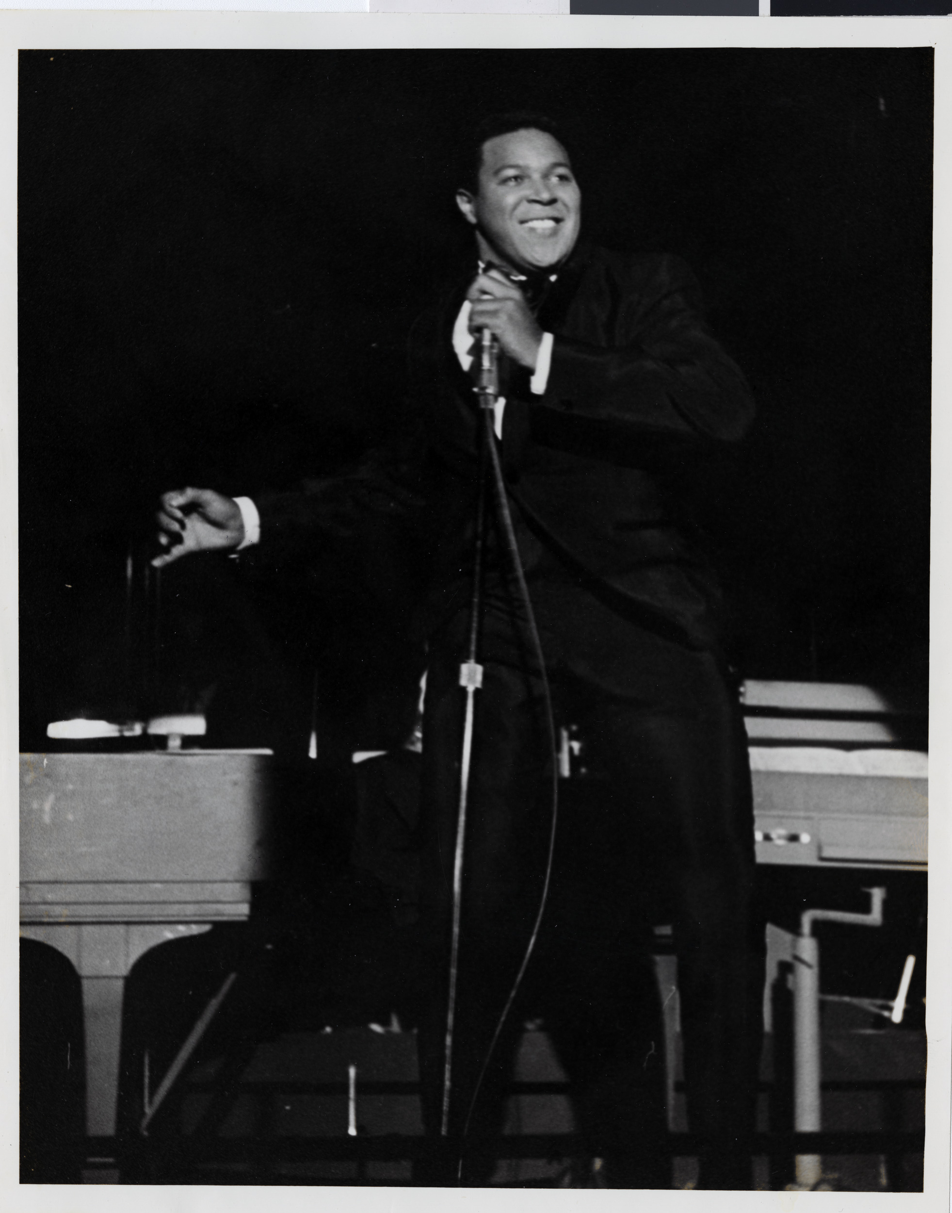Photograph of Chubby Checker performing onstage at the Sands Hotel, August 1962
