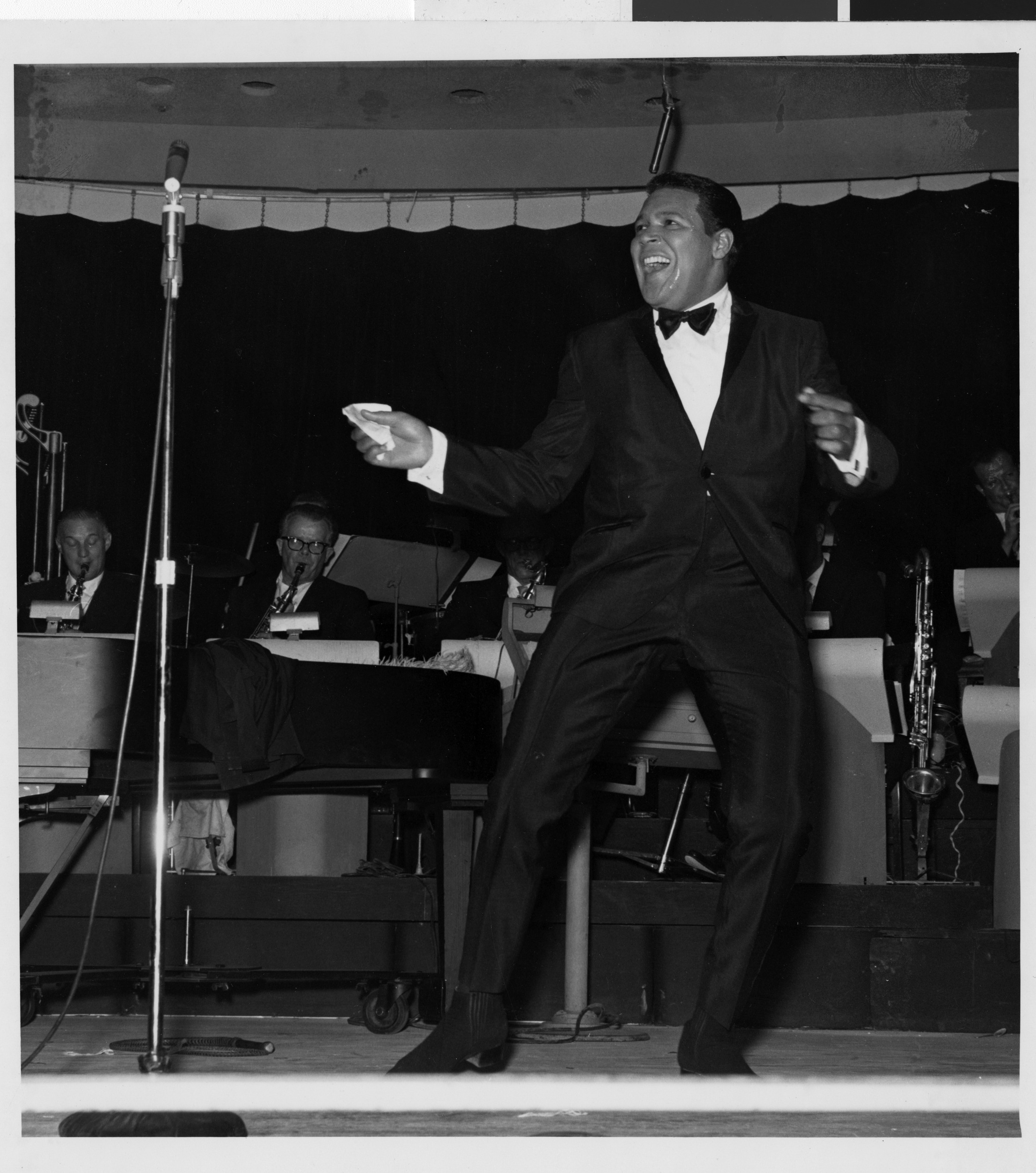 Photograph of Chubby Checker performing onstage at the Sands Hotel, August 1962