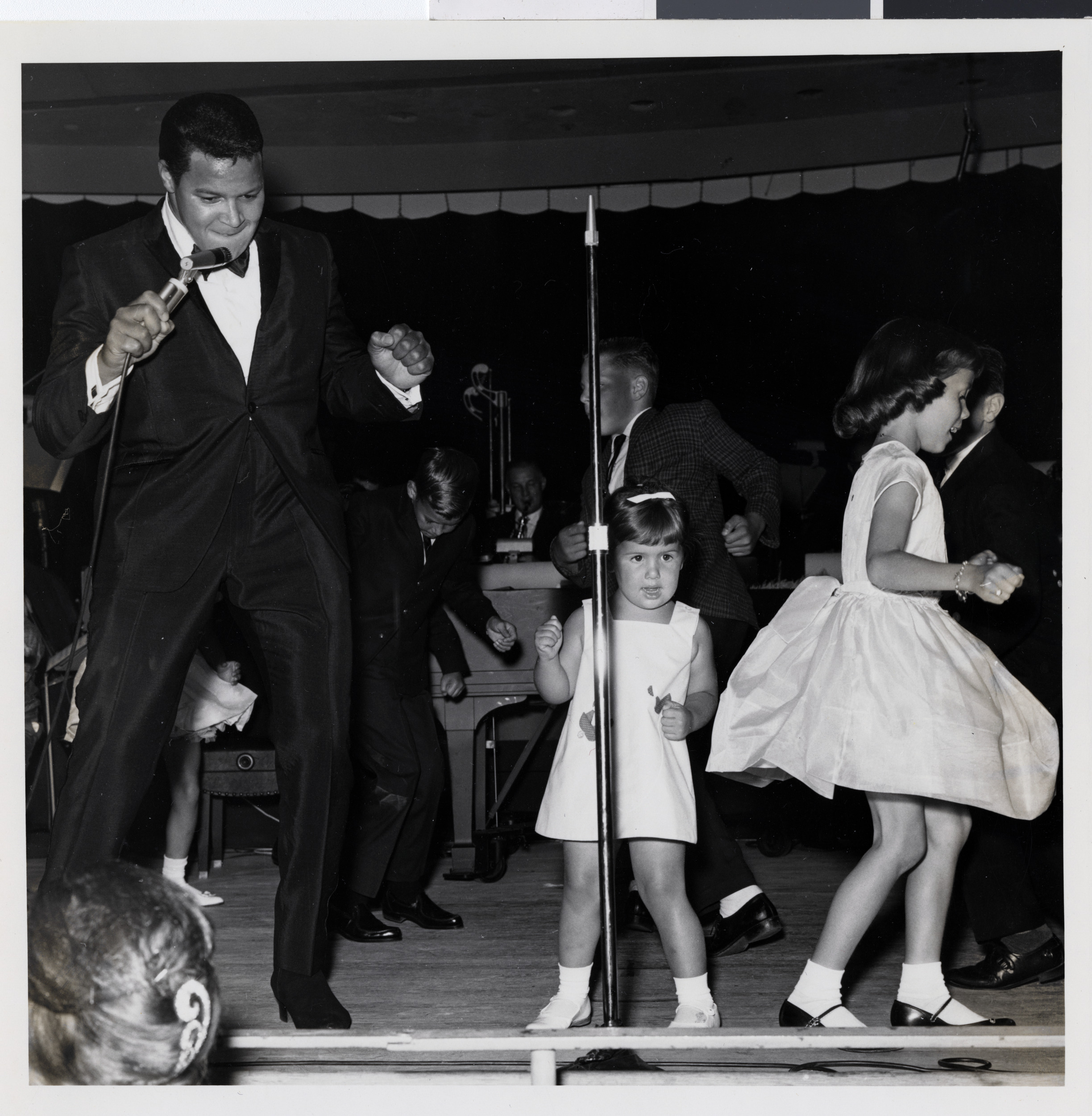 Photograph of Chubby Checker performing onstage at the Sands Hotel, August 1962