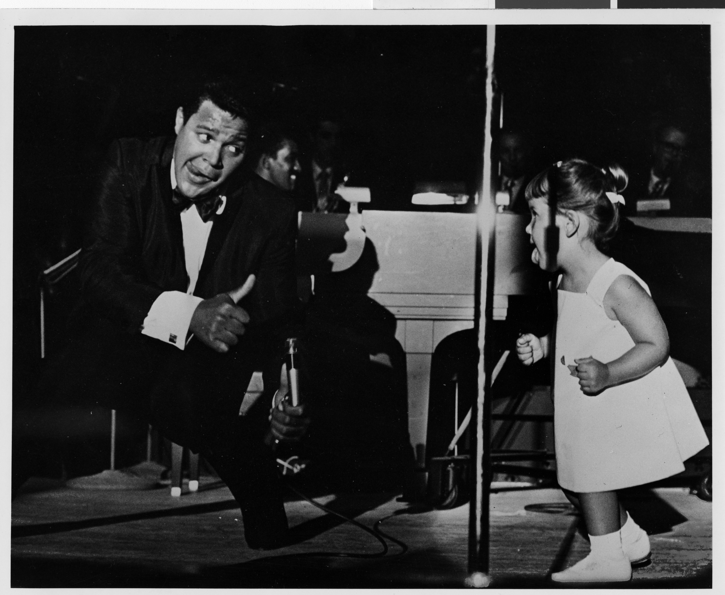 Photograph of Chubby Checker performing onstage at the Sands Hotel, August 1962