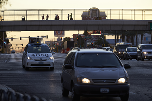 Pedestrian on walkway above Tropicana Avenue near Las Vegas Strip, Las Vegas, Nevada: digital photograph