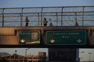 Pedestrian on walkway above Tropicana Avenue near Las Vegas Strip, Las Vegas, Nevada: digital photograph