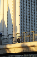 Pedestrian on walkway above Tropicana Avenue near Las Vegas Strip, Las Vegas, Nevada: digital photograph