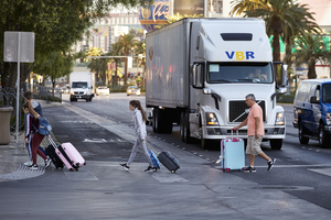 Tourist cross Las Vegas Boulevard at Park Avenue, Las Vegas, Nevada: digital photograph