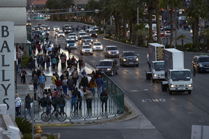 Tourists and cars on the Las Vegas Strip, Las Vegas, Nevada: digital photograph