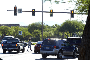 Pedestrian on West Sahara Avenue at Blue Willow Lane, Las Vegas, Nevada: digital photograph