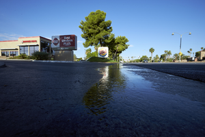 Water runoff on West Sahara Avenue in The Lakes development, Las Vegas, Nevada: digital photograph