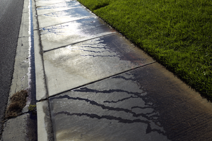 Water runoff on West Sahara Avenue in The Lakes development, Las Vegas, Nevada: digital photograph