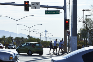 Pedestrians and traffic at the South Rainbow Boulevard and West Sahara Avenue intersection, Las Vegas, Nevada: digital photograph