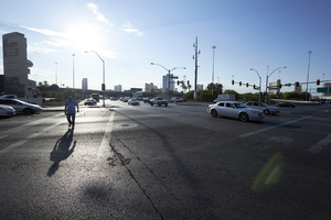 Pedestrian crosses Rancho Drive at West Sahara Avenue looking east, Las Vegas, Nevada: digital photograph