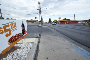 Advertising sign on South Arville Street looking south, Las Vegas, Nevada: digital photograph