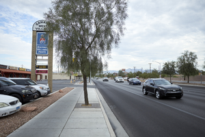 Business sign on West Sahara Avenue east of South Arville Street, Las Vegas, Nevada: digital photograph