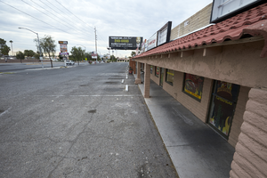 Strip mall parking on West Sahara Avenue looking east, Las Vegas, Nevada: digital photograph