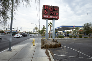 Herbs and Rye sign on West Sahara Avenue looking east, Las Vegas, Nevada: digital photograph