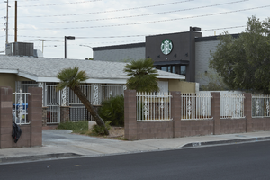 Single family house next to Starbucks Coffee on West Sahara Avenue at Rye Street, looking northwest, Las Vegas, Nevada: digital photograph