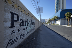 Brick wall advertisement and Monorail maintenance building on Joe W Brown Drive looking south, Las Vegas, Nevada: digital photograph