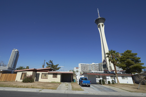 A home and the Stratosphere tower as seen from South Santa Clara Drive near East Sahara Avenue looking west, Las Vegas, Nevada: digital photograph