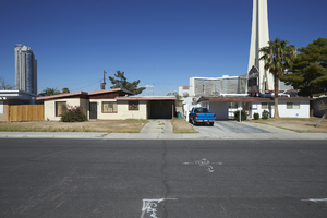 A home and the Stratosphere tower as seen from South Santa Clara Drive near East Sahara Avenue looking west, Las Vegas, Nevada: digital photograph