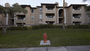 Sterling Sahara Apartments on East Sahara Avenue near Maryland Parkway looking south at dusk, Las Vegas, Nevada: digital photograph