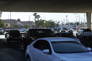Traffic flows under the freeway overpass at East Sahara Avenue and Sandhill Road looking east, Las Vegas, Nevada: digital photograph