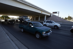 Traffic flows under the freeway overpass at East Sahara Avenue and Sandhill Road looking east, Las Vegas, Nevada: digital photograph